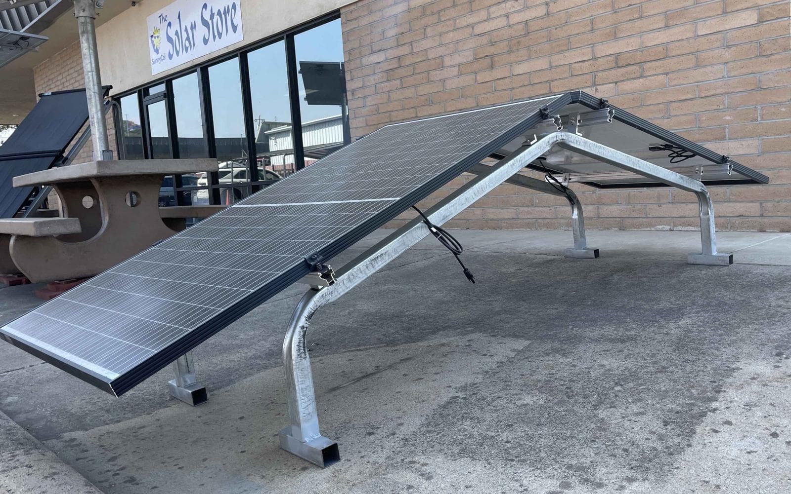 Dual-direction solar support with modules on opposing slopes